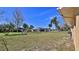 Fenced backyard with tropical landscaping offers privacy and a serene atmosphere at 209 Georgetowne Blvd, Daytona Beach, FL 32119