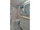 Bathroom featuring a shower-tub combo, drawers for storage and a mirrored vanity at 209 Georgetowne Blvd, Daytona Beach, FL 32119