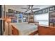 Cozy bedroom with a ceiling fan, dresser, and walls adorned with racing-themed decorations at 209 Georgetowne Blvd, Daytona Beach, FL 32119