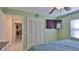 Bright bedroom with a ceiling fan, TV, and a closet for maximum storage at 209 Georgetowne Blvd, Daytona Beach, FL 32119