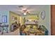 Charming dining area featuring unique fish-themed bench seating and a glass-top table, perfect for entertaining guests at 209 Georgetowne Blvd, Daytona Beach, FL 32119