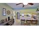 Bright kitchen featuring a breakfast bar and tile flooring extending into the dining area at 209 Georgetowne Blvd, Daytona Beach, FL 32119