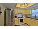 Efficient kitchen with stainless steel refrigerator and gas range at 209 Georgetowne Blvd, Daytona Beach, FL 32119