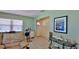 Comfortable living room with tiled floor, comfortable seating, and a view to the front porch at 209 Georgetowne Blvd, Daytona Beach, FL 32119