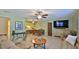 Open-concept living room with tile floors, comfortable seating, and ample space at 209 Georgetowne Blvd, Daytona Beach, FL 32119