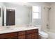 Well-lit bathroom featuring double sinks, a large mirror, and a shower/tub combo at 2934 Wild Tamarind Blvd, Orlando, FL 32828
