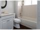 Clean bathroom featuring a combined bathtub and shower, a toilet, and a vanity with white cabinets at 2934 Wild Tamarind Blvd, Orlando, FL 32828