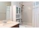 Bathroom includes shower and tub combo and plenty of shelving for storage and organization at 2934 Wild Tamarind Blvd, Orlando, FL 32828