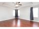 This spacious bedroom features a tray ceiling, recessed lighting and large windows letting in ample natural light at 2934 Wild Tamarind Blvd, Orlando, FL 32828