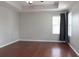Spacious bedroom featuring wood floors, neutral paint and large windows for natural light at 2934 Wild Tamarind Blvd, Orlando, FL 32828