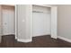 Bedroom with wood floors, neutral walls and an open closet with shelving for optimal storage at 2934 Wild Tamarind Blvd, Orlando, FL 32828