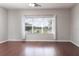 This well-lit room offers serene views through a large window, complementing its warm wood flooring at 2934 Wild Tamarind Blvd, Orlando, FL 32828