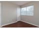 Bedroom with a window, closet and neutral walls with wood-look floors at 2934 Wild Tamarind Blvd, Orlando, FL 32828