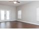 Bright, open living space with wood floors and a glass door leading to the outdoor area at 2934 Wild Tamarind Blvd, Orlando, FL 32828