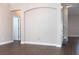 Spacious living room featuring hardwood floors and an elegant archway, creating a welcoming atmosphere at 2934 Wild Tamarind Blvd, Orlando, FL 32828