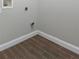 This empty utility room features tile flooring, white trim, and washer/dryer hookups at 2934 Wild Tamarind Blvd, Orlando, FL 32828