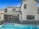 View of the home's exterior with patio, pool, and backyard featuring a safety fence at 3206 Harrison Ave, Orlando, FL 32804