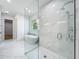 Modern bathroom with a glass shower and free standing tub with marble tile at 3206 Harrison Ave, Orlando, FL 32804