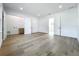 Bright bedroom boasts wood floors, white walls, with closet space and convenient laundry area at 3206 Harrison Ave, Orlando, FL 32804