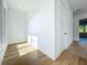 Bedroom with light floors, white walls and trim, and a bright window at 3206 Harrison Ave, Orlando, FL 32804