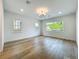 Bonus room with light floors, recessed lighting, and multiple windows overlooking trees at 3206 Harrison Ave, Orlando, FL 32804