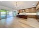 Open kitchen with custom cabinetry, an island, and access to outdoor pool at 3206 Harrison Ave, Orlando, FL 32804