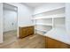 Home office with built-in shelves, cabinets, and hardwood flooring at 3206 Harrison Ave, Orlando, FL 32804