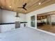 Outdoor kitchen with wood ceilings, grill, sink, and easy access to indoor kitchen at 3206 Harrison Ave, Orlando, FL 32804