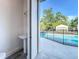 Convenient outdoor pool bathhouse featuring a pedestal sink and easy access to the pool area at 3206 Harrison Ave, Orlando, FL 32804
