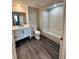 Well-lit bathroom featuring a modern vanity with storage and a shower-tub combination at 322 E Central Blvd # 1805, Orlando, FL 32801