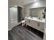 Bathroom featuring double sinks, modern vanity, full mirror and a shower and tub combination at 322 E Central Blvd # 1805, Orlando, FL 32801