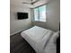 Bedroom with large windows, ceiling fan and wall mounted television at 322 E Central Blvd # 1805, Orlando, FL 32801