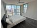 Bedroom with large windows offering cityscape views and modern flooring at 322 E Central Blvd # 1805, Orlando, FL 32801