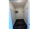 Spacious walk-in closet with installed shelving and modern flooring at 322 E Central Blvd # 1805, Orlando, FL 32801