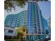 Modern high-rise condo building featuring a distinctive design and a vibrant color scheme at 322 E Central Blvd # 1805, Orlando, FL 32801