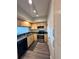Modern kitchen featuring stainless steel appliances, light wood cabinets, and dark countertops at 322 E Central Blvd # 1805, Orlando, FL 32801