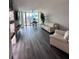 Bright living room featuring dark floors, a fireplace, floor-to-ceiling windows and comfortable seating at 322 E Central Blvd # 1805, Orlando, FL 32801