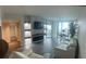 Bright living room with fireplace, dark floors, and access to a balcony overlooking a city view at 322 E Central Blvd # 1805, Orlando, FL 32801