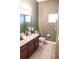 Bathroom featuring dark wood vanity, ample counter space and recessed lighting at 346 Canyon Stone Cir, Lake Mary, FL 32746
