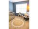 Cozy Bedroom featuring a crib, rocking chair, and soft textures at 346 Canyon Stone Cir, Lake Mary, FL 32746