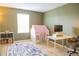 Bedroom with a play area featuring a rug, play house, and desk space at 346 Canyon Stone Cir, Lake Mary, FL 32746