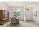 Bright dining room with a large window, chandelier, and a classic wooden china cabinet at 3603 Westover Cir, Leesburg, FL 34748