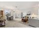 Bright and airy living room featuring neutral tones, a chandelier, and an open layout for seamless entertaining at 3603 Westover Cir, Leesburg, FL 34748