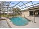 Enclosed pool with hot tub and patio area at 3603 Westover Cir, Leesburg, FL 34748
