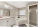 This bathroom features a soaking tub, shower, vanity with sink, and a neutral color scheme at 37 Spring Ln, Haines City, FL 33844