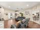 Spacious living room with hardwood floors, decor, and open access to other rooms at 37 Spring Ln, Haines City, FL 33844