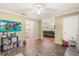 Bright playroom with a TV and toy area that connects to the living room and kitchen at 37 Spring Ln, Haines City, FL 33844