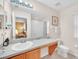 Bathroom features a single vanity, a mirror, and a shower-tub combo at 438 Miramar Ave, Davenport, FL 33897