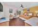 Bright bedroom features a ceiling fan, desk, and a comfortable king-size bed at 438 Miramar Ave, Davenport, FL 33897