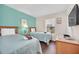 Cozy bedroom with two twin beds, side table, and natural light at 438 Miramar Ave, Davenport, FL 33897